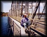 KEVIN BICYCLING ACROSS THE BRIDGE IN STURGEON BAY, WI, MAY 1997.jpg 7.0K